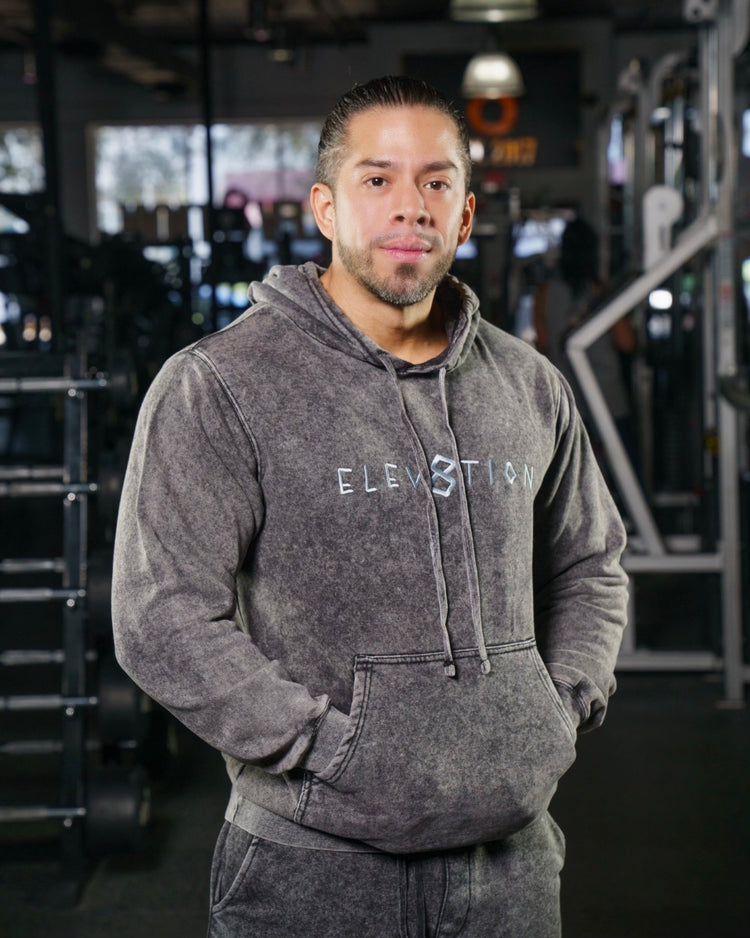 gray acid wash hoodie with Elev8tion across the chest