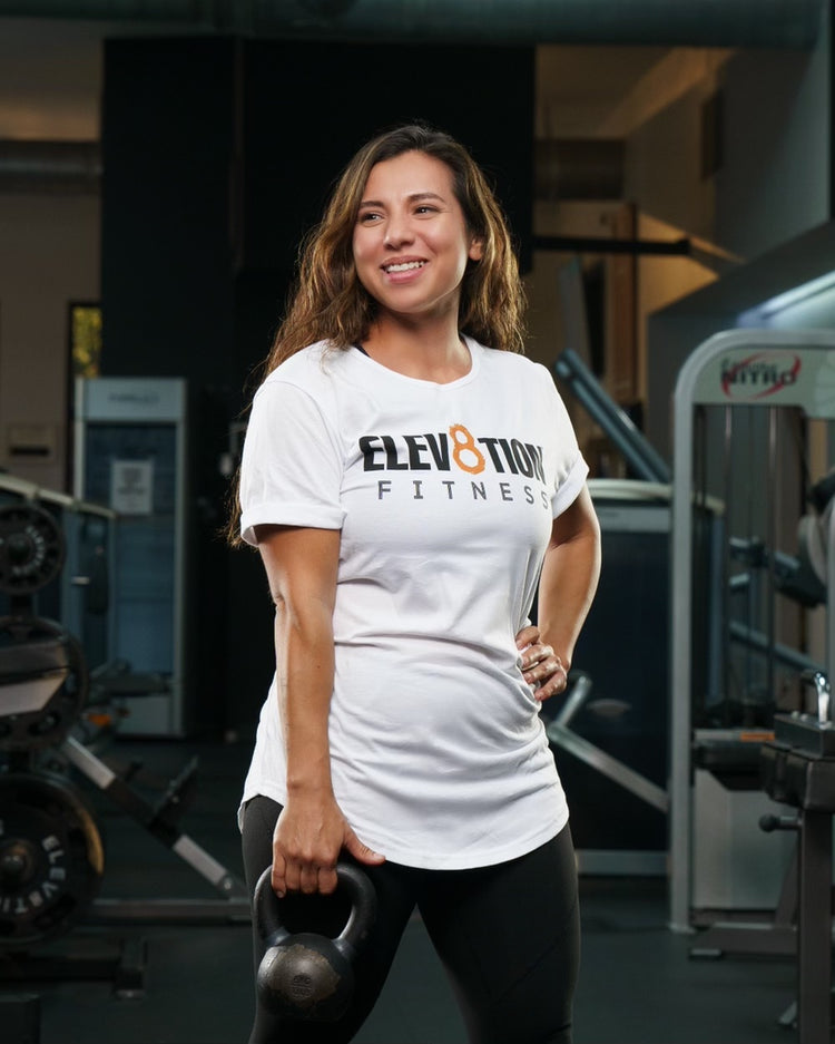 white scoop bottom hem tee with the Elev8tion Fitness logo across the chest