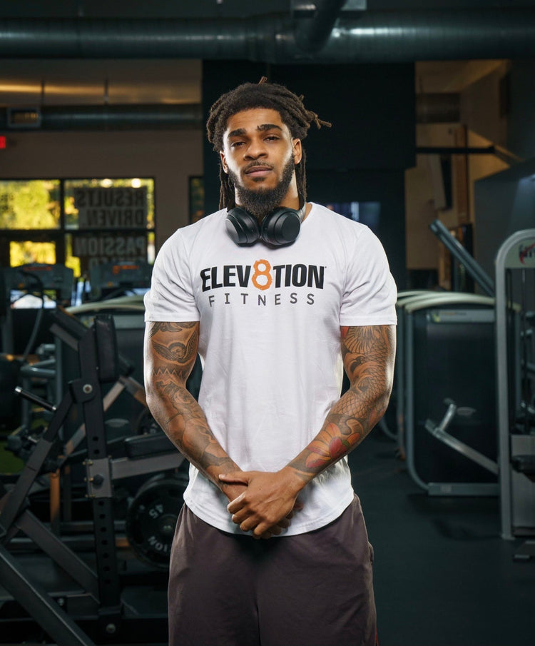 white scoop bottom hem tee with the Elev8tion Fitness logo across the chest